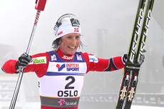Marit Bjørgen etter gullet på 15 km med skibytte i Oslo-VM 2011. Foto: Hemmersbach/NordicFocus.