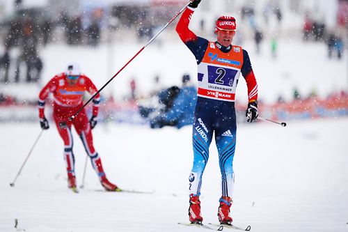 Maxim Vylegzhanin avgjør verdenscupstafetten på Lillehammer 2013. Bak i bildet følger Petter Northug jr. for Norge I, som gikk inn til 3. plass etter Finn Hågen Krogh for Norge II. Foto: Laiho/NordicFocus. Maxim Vylegzhanin avgjør verdenscupstafetten på Lillehammer 2013. Bak i bildet følger Petter Northug jr. for Norge I, som gikk inn til 3. plass etter Finn Hågen Krogh for Norge II. Foto: Laiho/NordicFocus.