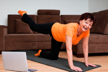 bs-woman-exercising-home-51780523-300