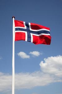 The Norwegian flag against a blue sky
