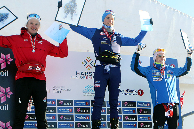 Seierspallen for Menn 18 år etter 15 kilometer i fri teknikk under Junior-NM i Harstad 2017. Fra venstre: Filip Fjeld Andersen (2. plass), Håvard Moseby (1) og Anders Kolstadbakken (3). Foto: Erik Borg. Seierspallen for Menn 18 år etter 15 kilometer i fri teknikk under Junior-NM i Harstad 2017. Fra venstre: Filip Fjeld Andersen (2. plass), Håvard Moseby (1) og Anders Kolstadbakken (3). Foto: Erik Borg.