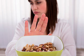 bs-Woman-Refusing-NutFood-235889101-400